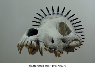 Wolf Skull With Metaphoric Crown Made Of Screws On A Top
