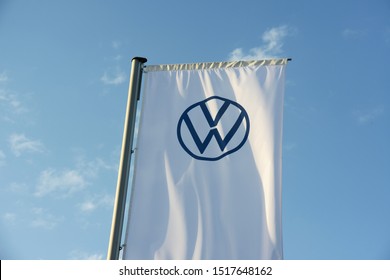 Wolfsburg, Lower Saxony / Germany - September 27, 2019: Flag with VW logo of Volkswagen AG in Wolfsburg, Germany - VW is one of the world's leading manufacturers of automobiles