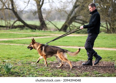 Wolverton,Bucks,UK - March 17th 2021. Police Dog With His Handler