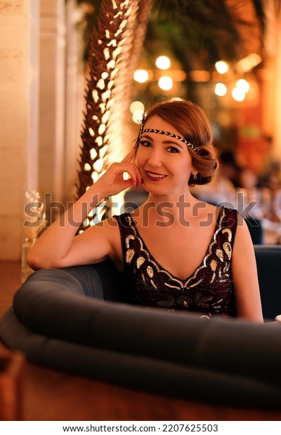 Woman in 1920 style clothes.\
Beautiful girl retro flapper style retro vintage roaring 20s.\
