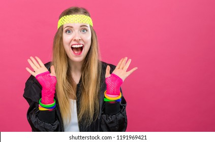 Woman In 1980's Fashion Theme On A Pink Background