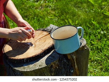 A Woman 30-35 Years Old Cleanses The Eggs From The Shell. Model Peeling Egg. The Process Of Cooking Salad. 