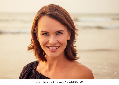 Woman, 30-35 Years Old Smiling Toothy Smile With Braces On Sea Ocean Beach Background