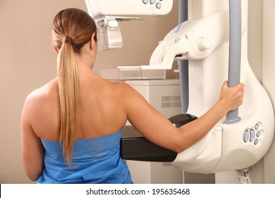 Woman in 40s about to undergoing a mammography test.