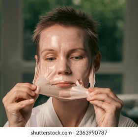 woman 43 years old with a cosmetic mask on her face - Shutterstock ID 2363990787