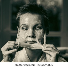 woman 43 years old with a cosmetic mask on her face - Shutterstock ID 2363990805