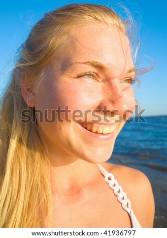 Similar – Portrait of a young woman on the beach