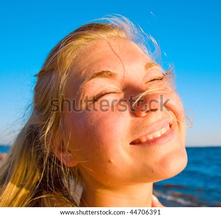 Similar – Portrait of a young woman on the beach