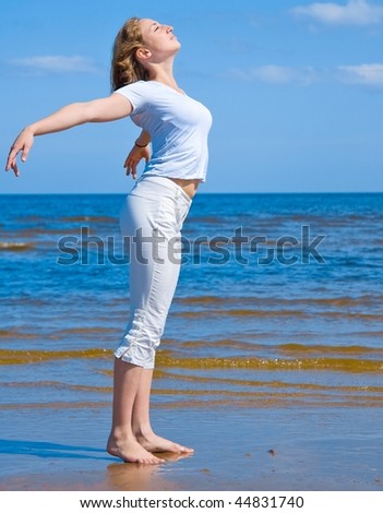 Similar – Young woman walks on the beach