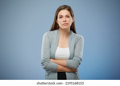 Woman With Abdominal Pain With Hands On Her Stomach. Isolated Female Portrait On Blue.