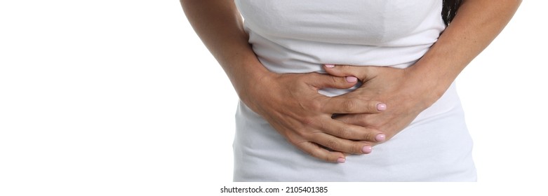 Woman With Abdominal Pain In White T-shirt And White Background. Causes Of Lower Abdominal Pain Concept