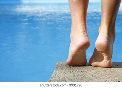 Woman About To Dive Into Bright Blue Pool