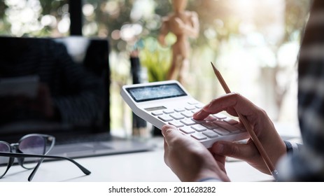 Woman Accountant Or Banker Using Calculator In Retro Office. 