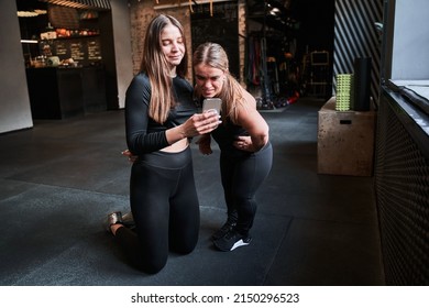 Woman With Achondroplasia Disorder Talking With Her Female Trainer