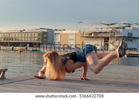 woman acrobat body on one hand