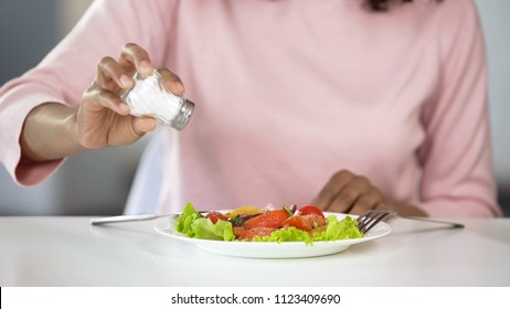 Woman Adding Too Much Salt To Her Food, Unhealthy Eating, Dehydration Problems