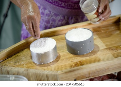 Woman Adding Salt To Artisan Soft Goat Cheese