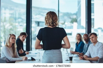 Woman addressing a meeting in office boardroom. Businesswoman having a meeting with her office staff. - Shutterstock ID 1786572083