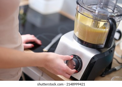 Woman adjusting speed of food processor closeup - Powered by Shutterstock