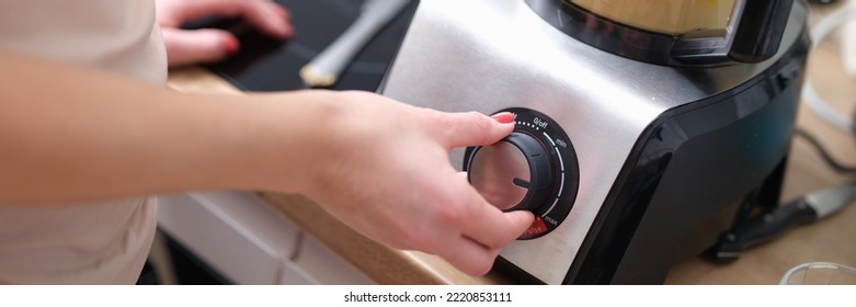 Woman Adjusting Speed Of Food Processor Closeup