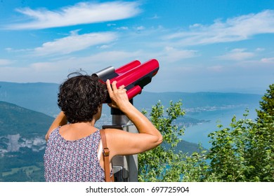 A woman admires Lake Annecy at the Col de la Forclaz