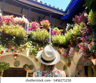 Woman admiring flowers in Andalusia, Spain