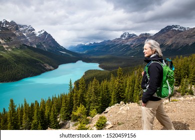 Woman admiring the scenic view of Peyto Lake in Banff National Park in Alberta, Canada	