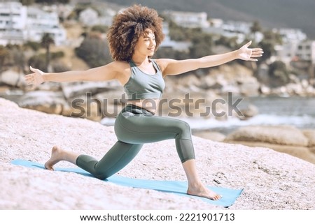 Woman, afro or beach yoga mat for relax stretching, fitness workout or exercise on Brazilian ocean, sea or water rock. Smile, happy or zen yogi in pilates training for mental health or body wellness