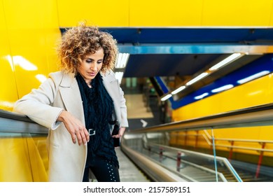 Woman With Afro Hair Going Up The Escalator