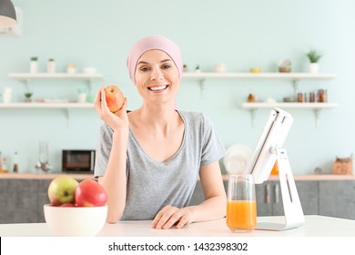 Woman After Chemotherapy In Kitchen At Home