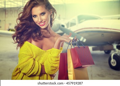 Woman After Shopping In Airport