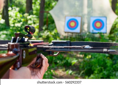 Woman Aiming Crossbow At Target Outdoor