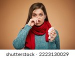 Woman with allergy or cold symptom runny nose usng tissue. isolated female portrait. Medicine advertising concept.