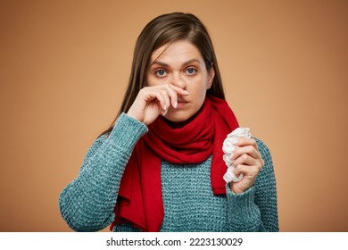 Woman with allergy or cold symptom runny nose usng tissue. isolated female portrait. Medicine advertising concept.