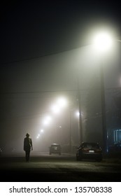 Woman Alone In The Middle Of The Foggy Street