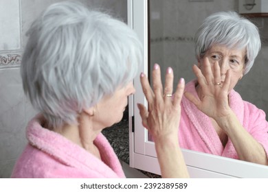 Woman with amnesia trying to recognize her own image  - Powered by Shutterstock