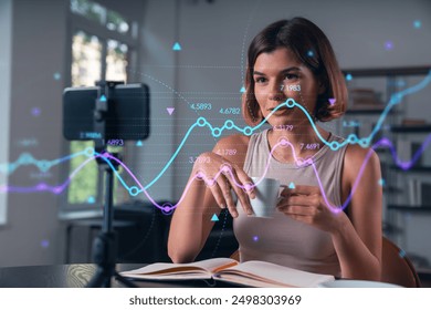 Woman analyzing digital graph data on a smartphone while vlogging, in a home studio. Concept of technology and business analysis - Powered by Shutterstock