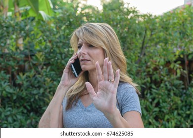 Woman Annoyed Speaking On Phone
