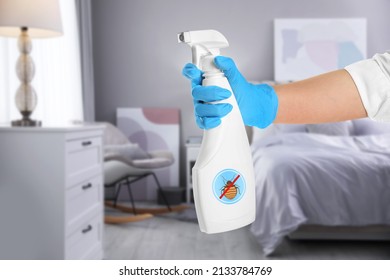 Woman with anti bed bug spray in bedroom, closeup
