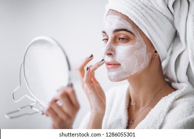 Woman Aplying Beauty Mask,close Up