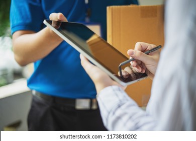 Woman Appending Signature Sign On Tablet After Accepting Receive Boxes From Delivery Man, Woman Sign On Digital Tablet, Receive Delivery Concept