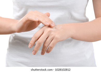 Woman applying body cream onto skin, closeup - Shutterstock ID 1028102812