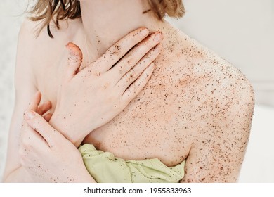 Woman Applying Body Exfoliating Scrub. Natural Organic Coffee Polish On A Woman's Body 