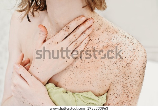 woman applying body exfoliating scrub.\
natural organic coffee polish on a woman\'s body\
