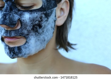 Woman Applying Bubble Charcoal Sheet Mask. Face Treatment. Popular Korean Cosmetics.Oxygen Mask.