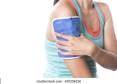 Woman Applying Cold Pack On Her Arm