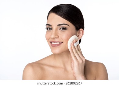 Woman Applying Cosmetic Powder On Face