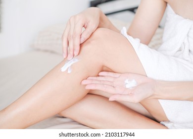 Woman applying cream,lotion on leg with white background, Beauty concept. - Powered by Shutterstock