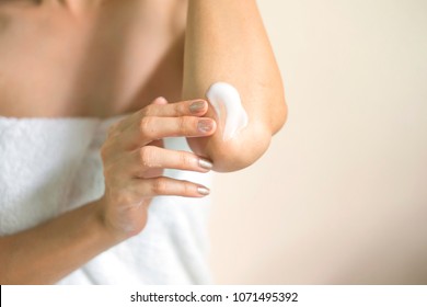 Woman Applying Elbow Cream/lotion, Hygiene Skin Body Care Concept.
