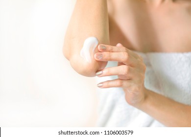 Woman Applying Elbow Cream,lotion , Hygiene Skin Body Care Concept.
